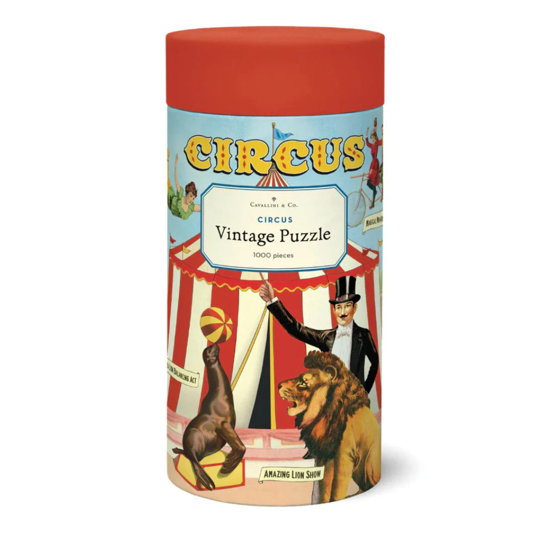 Cylindrical packaging for a circus-themed vintage puzzle with colorful illustrations on a white background.