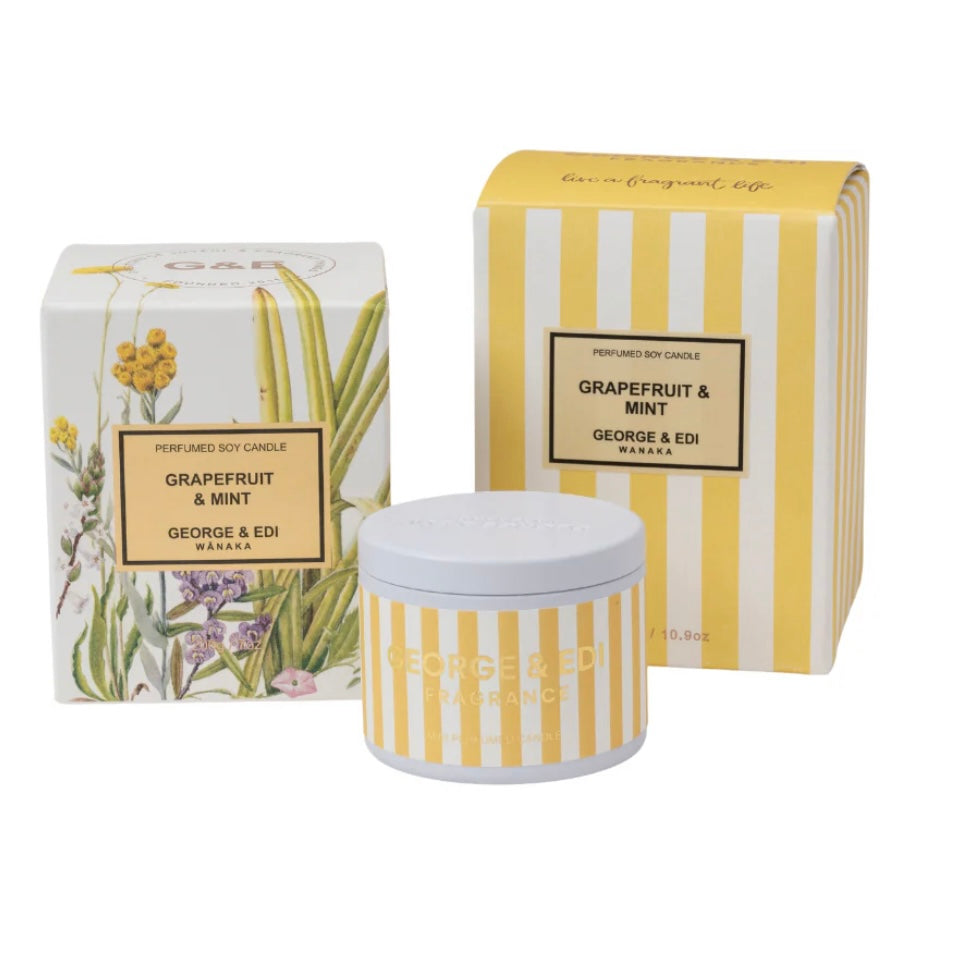 Perfumed soy candle with packaging featuring grapefruit and mint design on a white background