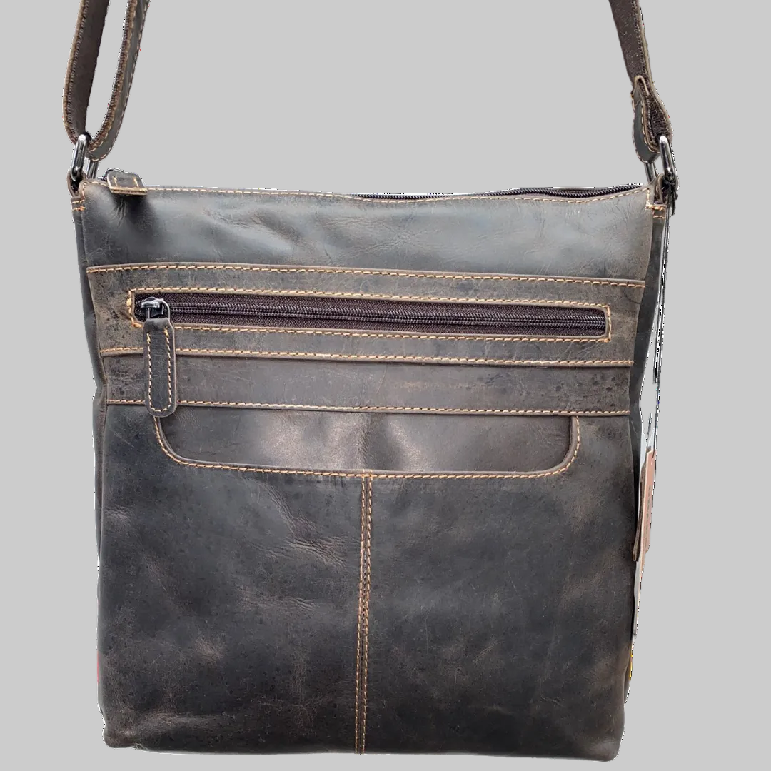 Dark brown leather crossbody bag on a white background