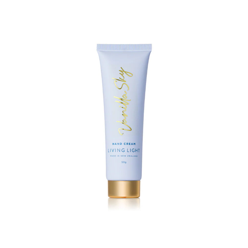 Hand cream tube with gold cap on a white background