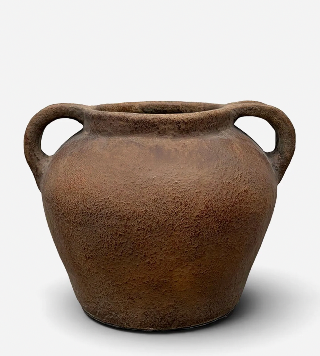 Brown ceramic pot with two handles on a white background