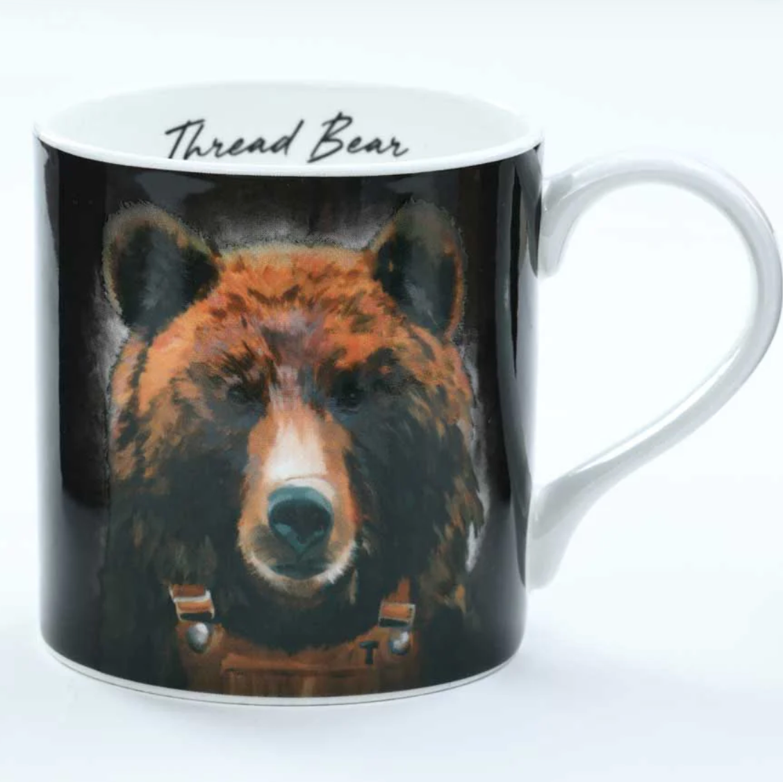 Mug with bear design and 'Thread Bear' branding on a white background