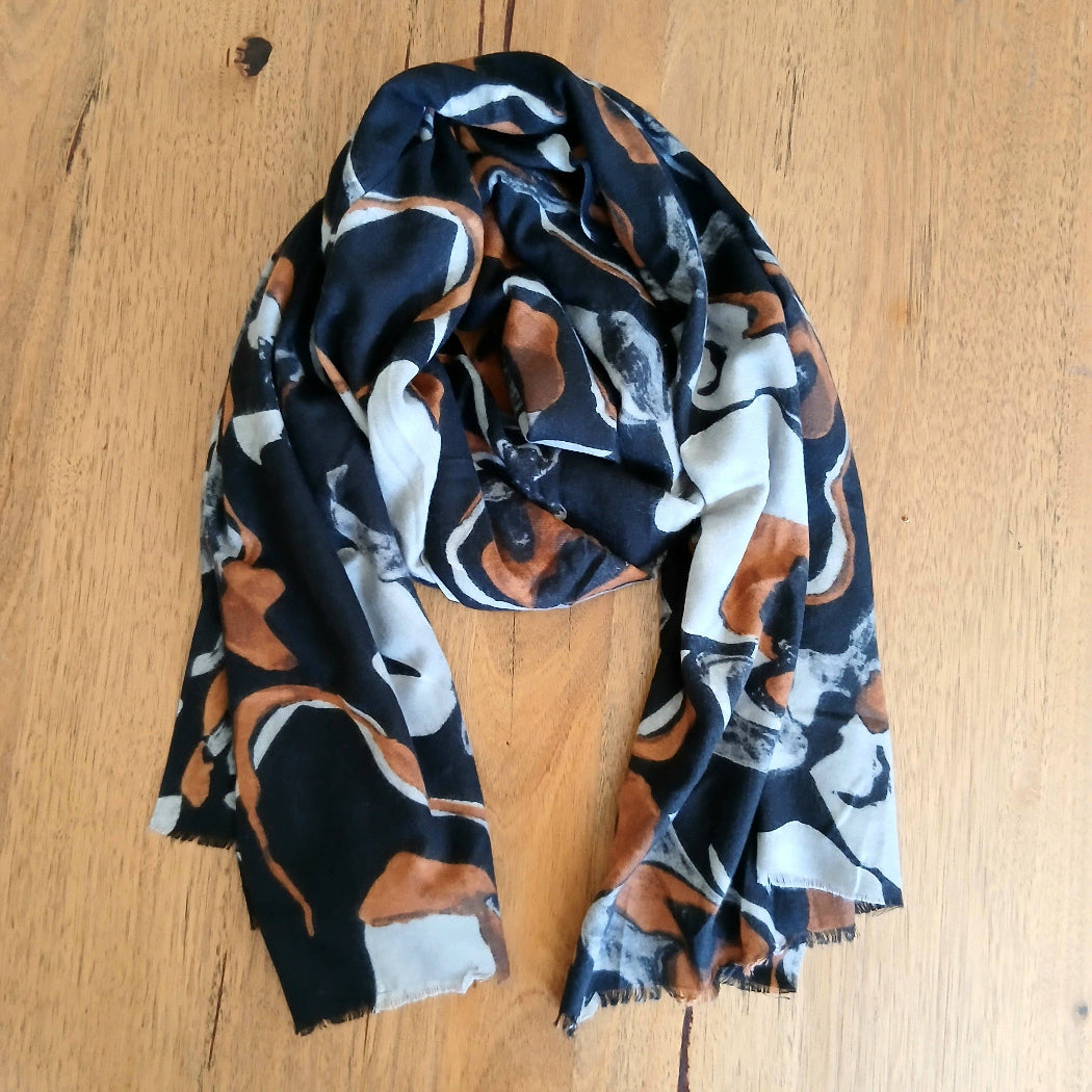 Patterned scarf on a wooden surface