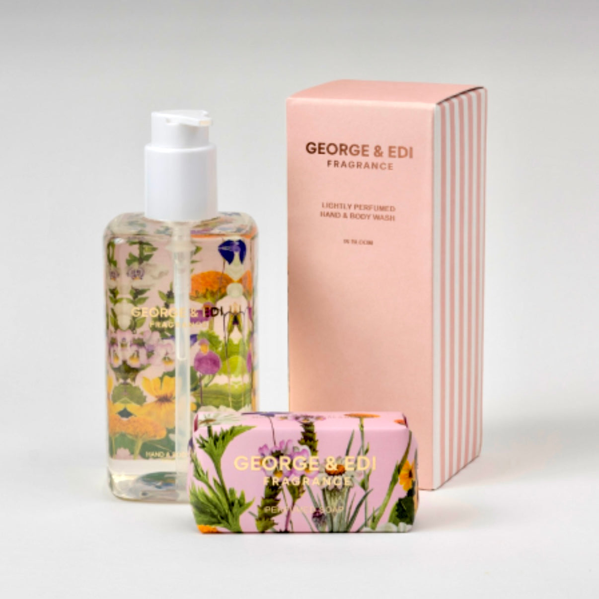 a collection of George & Edi soap and body wash products on a white surface