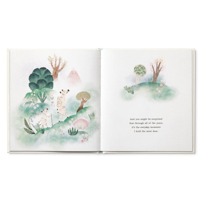 Open book with illustrations of trees and animals on a white background