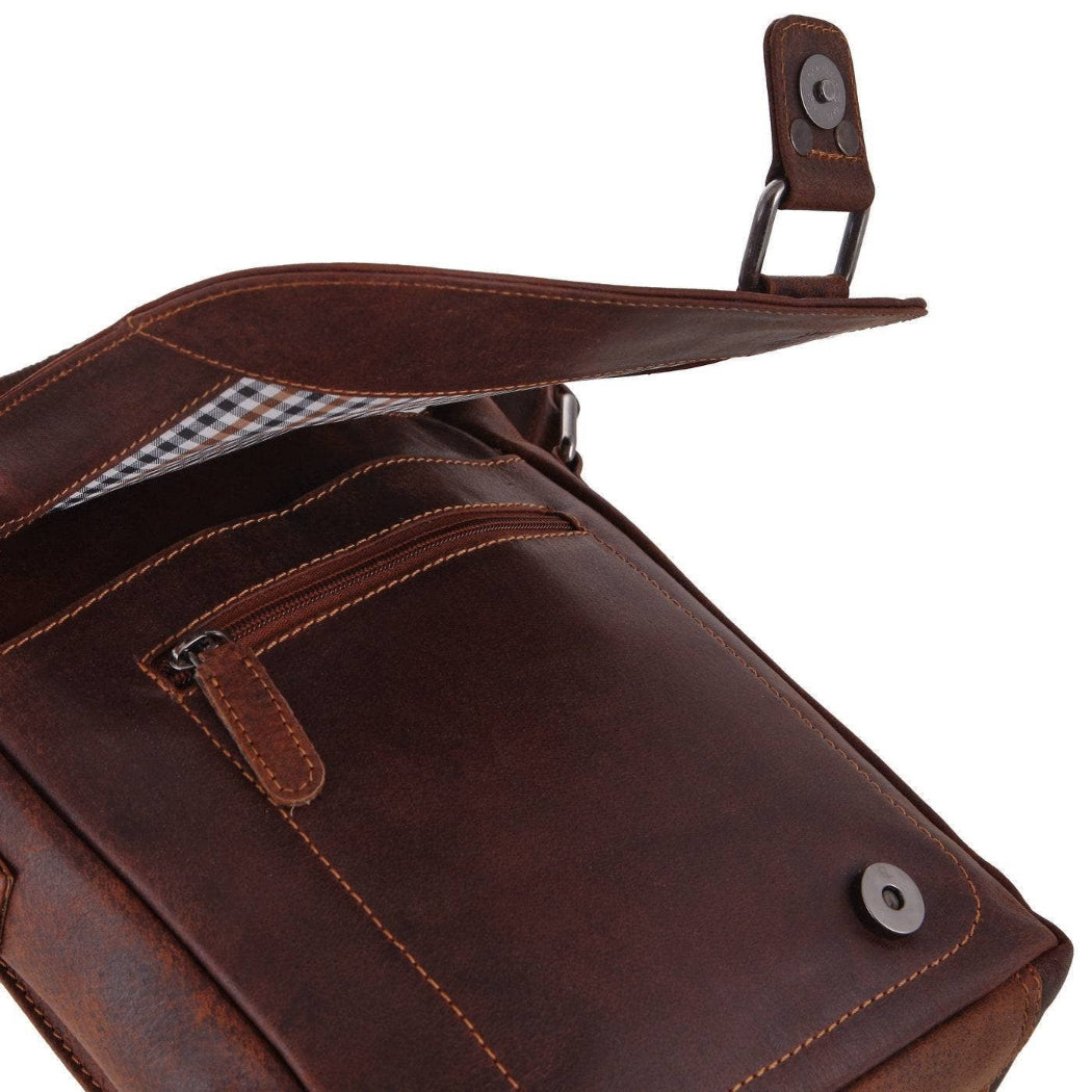 Brown leather bag with a checkered lining on a white background