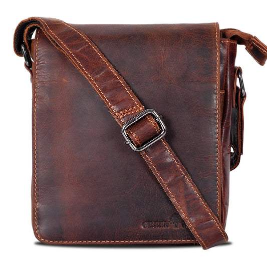 Brown leather crossbody bag with a buckle on a white background