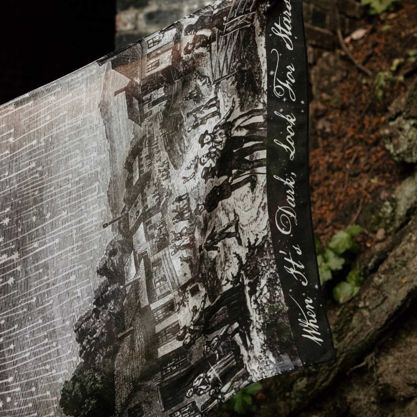 Book with a black and white illustration on a textured surface