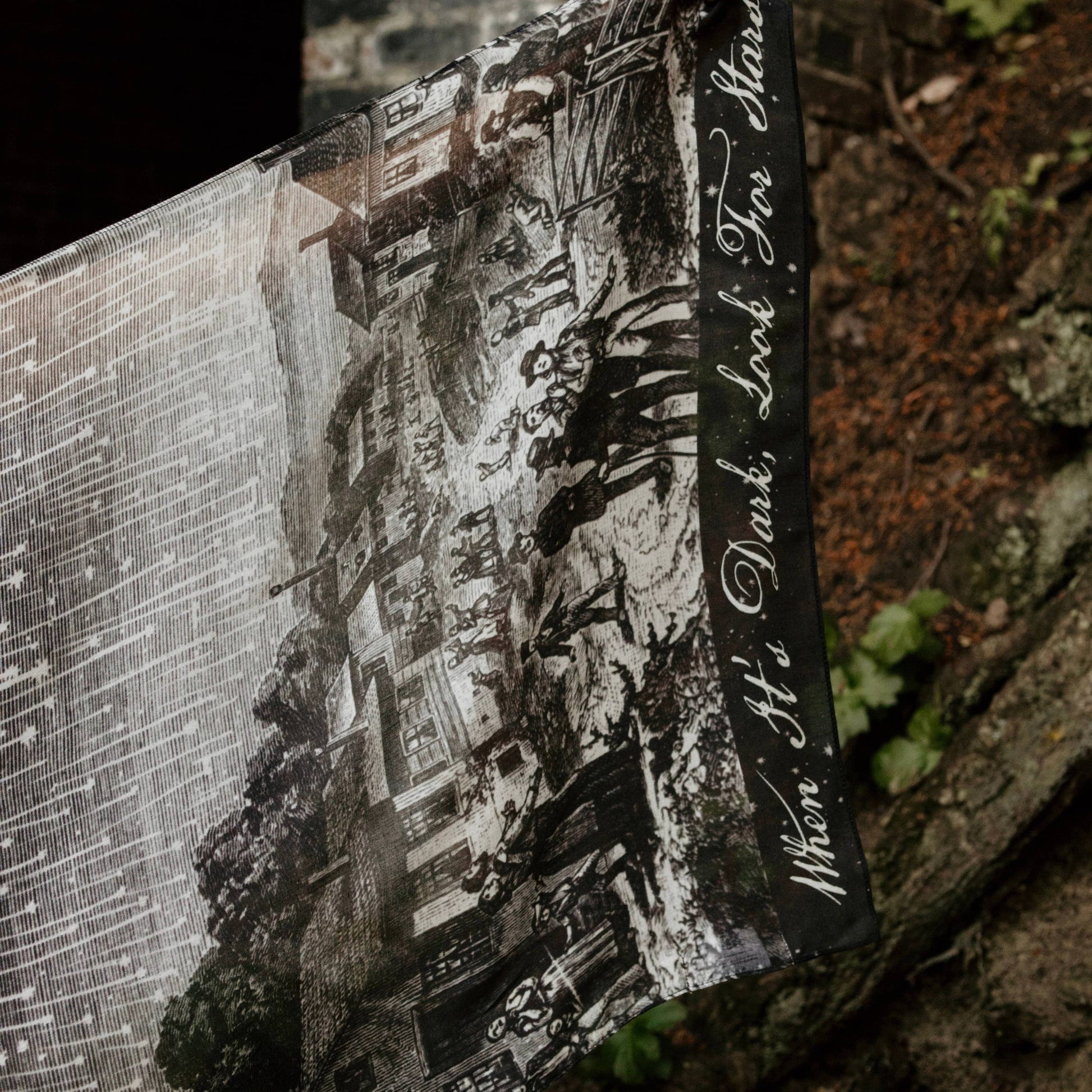 Book with a black and white illustration on a textured surface