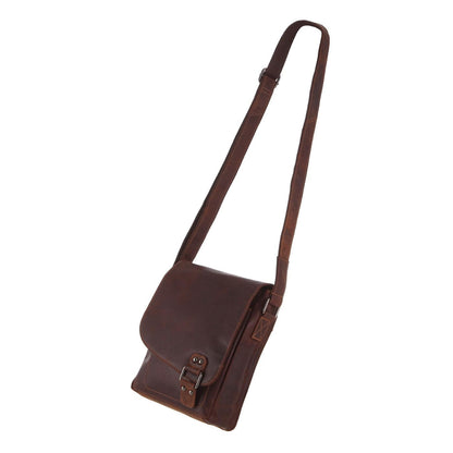 Brown leather bag with a strap on a white background