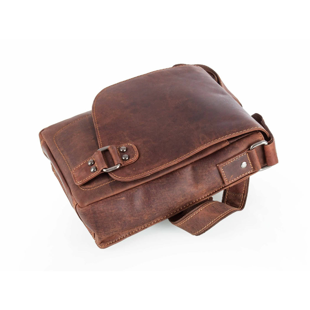 Brown leather satchel bag on a white background