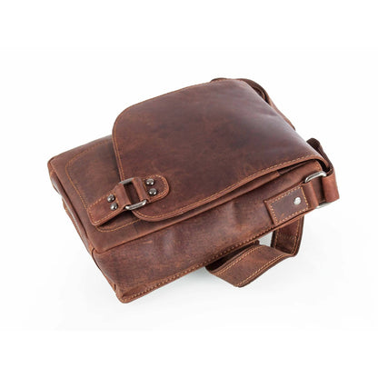 Brown leather satchel bag on a white background