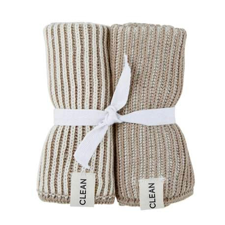 Knitted beige towel with white stripes and 'Clean' labels on a white background