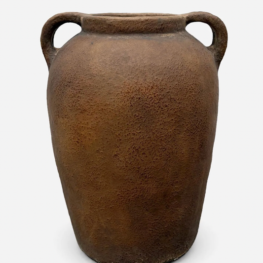 Brown ceramic vase with two handles on a white background