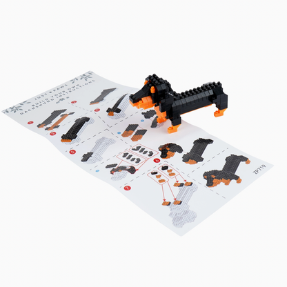 Toy dog figure made of interlocking bricks on a design sheet