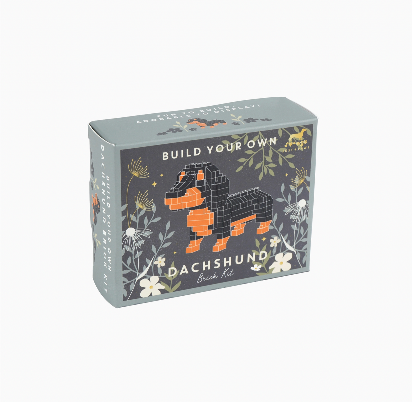 Box for building a dachshund model with floral designs on a white background