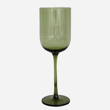 Green wine glass on a white background