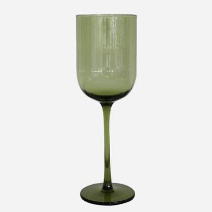Green wine glass on a white background