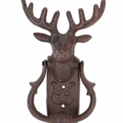 Decorative door knocker shaped like a deer head on a white background