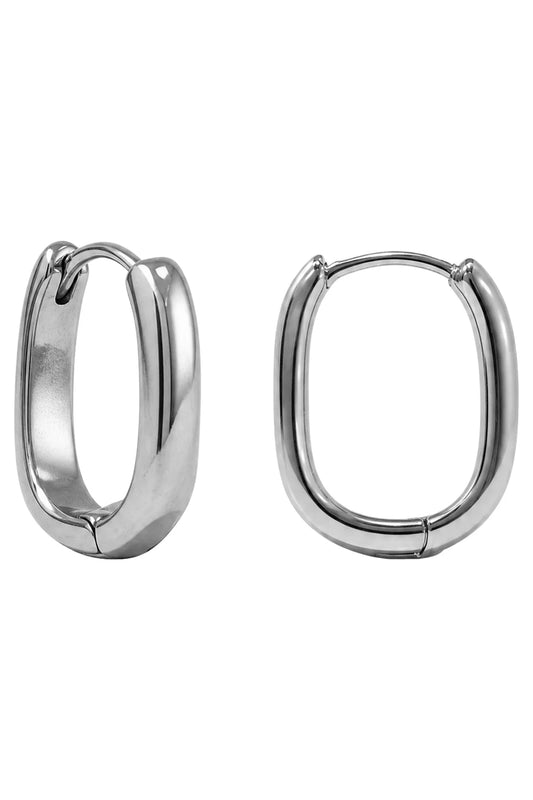 A pair of polished silver-tone hoop earrings with a thick, rounded rectangular shape, shown on a plain white background.