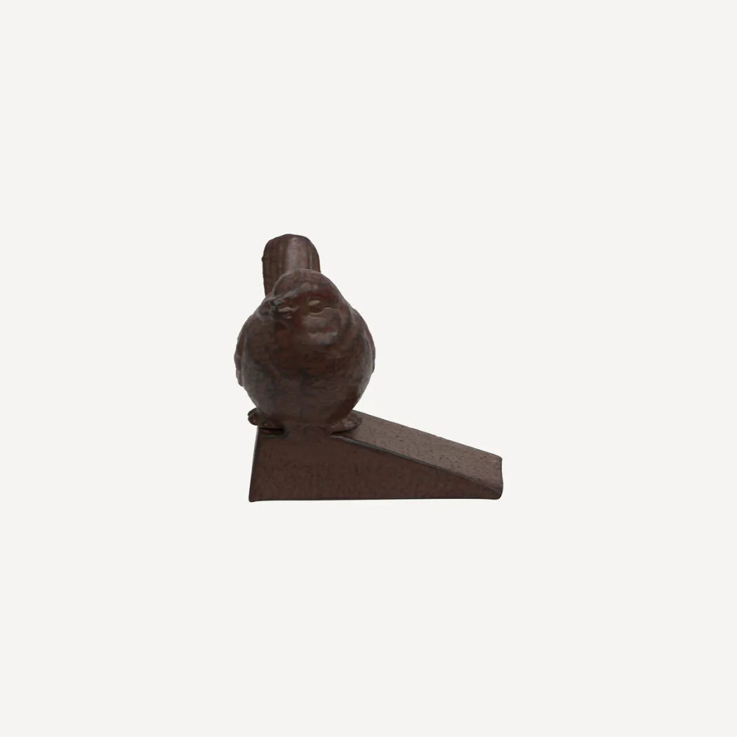 Brown bird door stop on a  white background