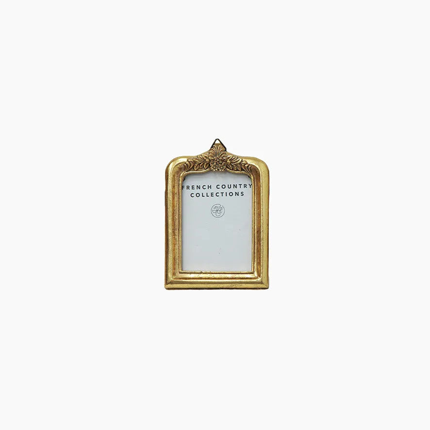 Decorative gold picture frame on a white background