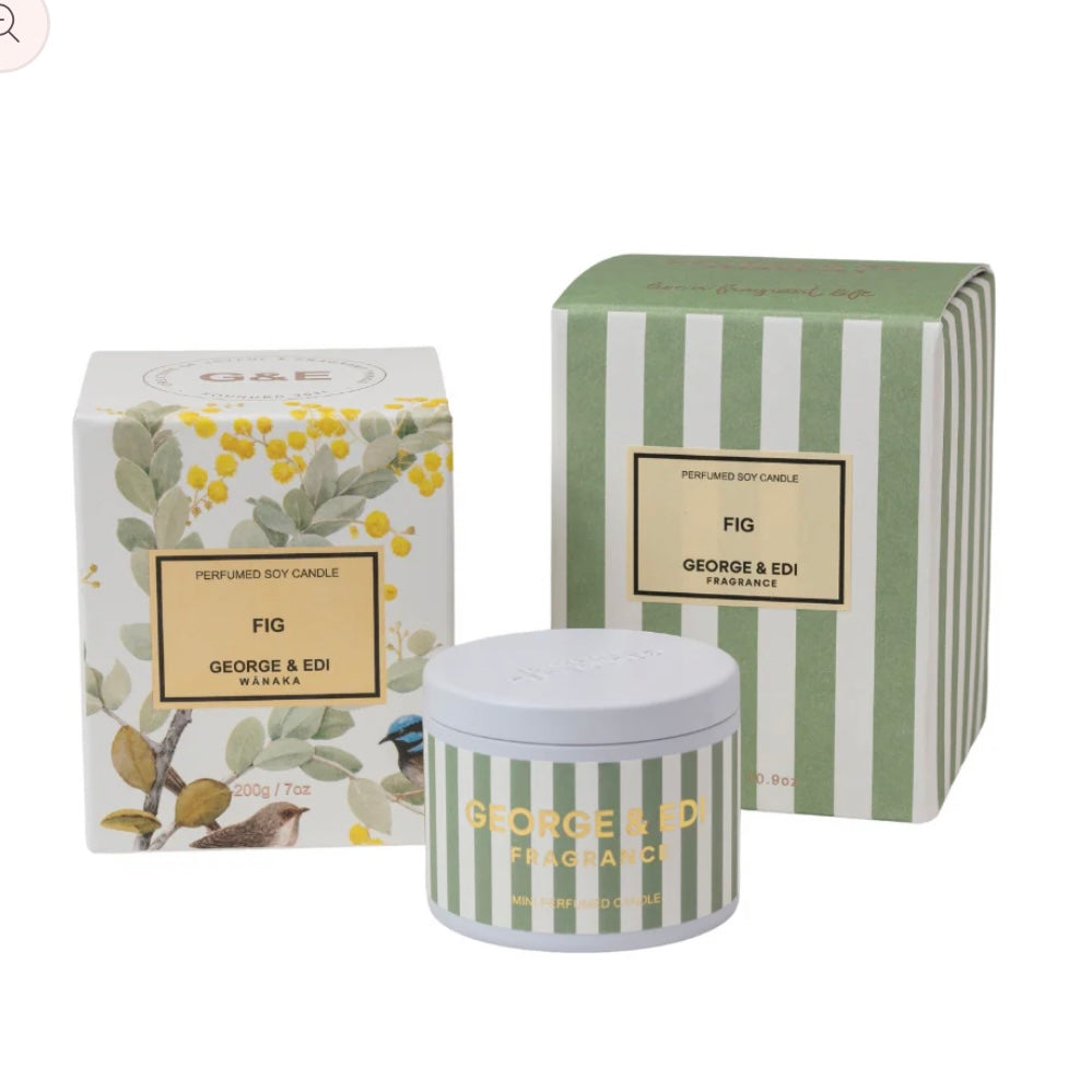 Candle and packaging with 'George & Edi' branding on a white background
