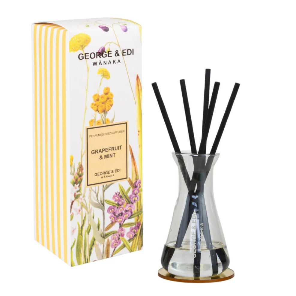 Diffuser with black sticks and packaging labeled 'George & Edi Wanaka' on a white background
