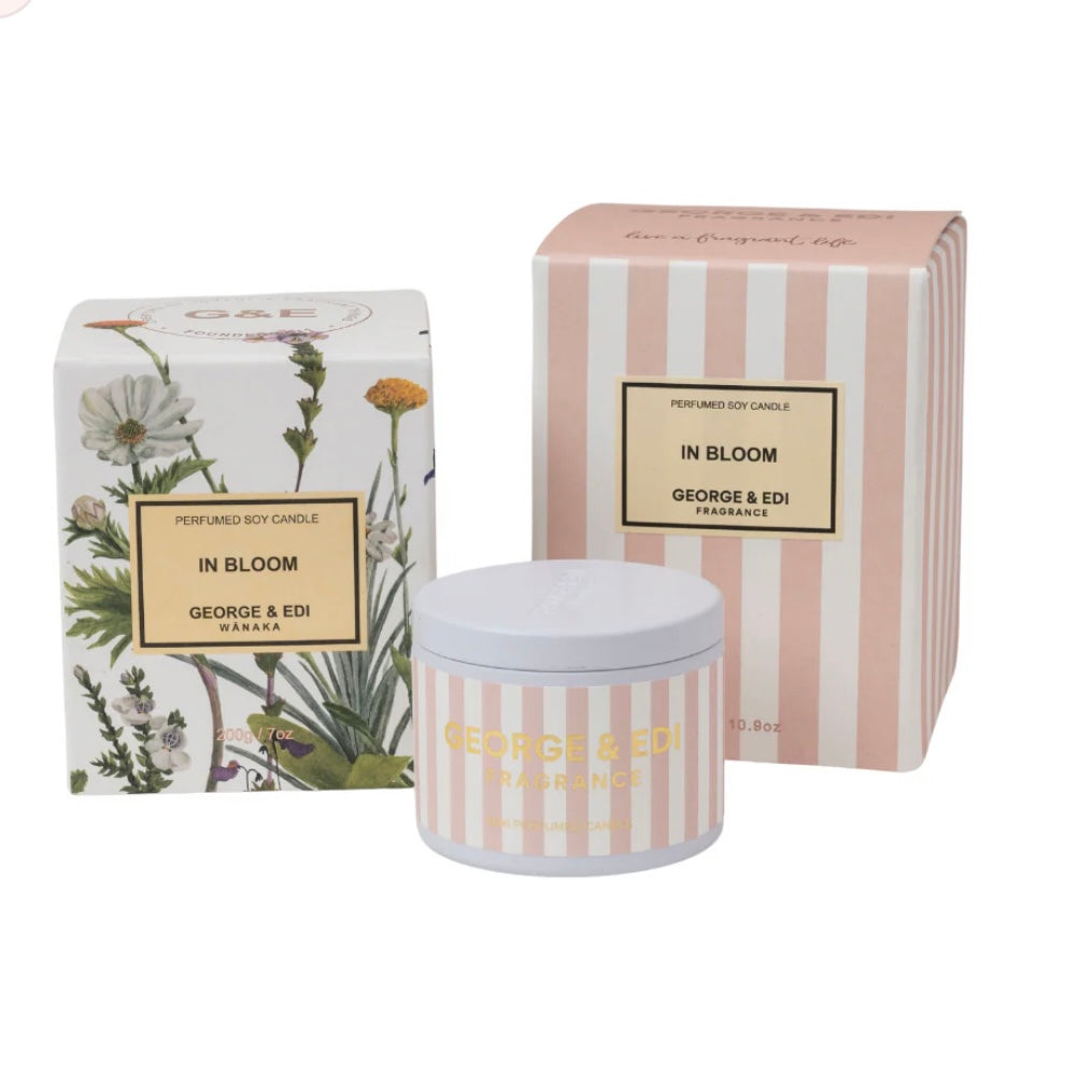 Perfumed soy candle and packaging with floral design on a white background