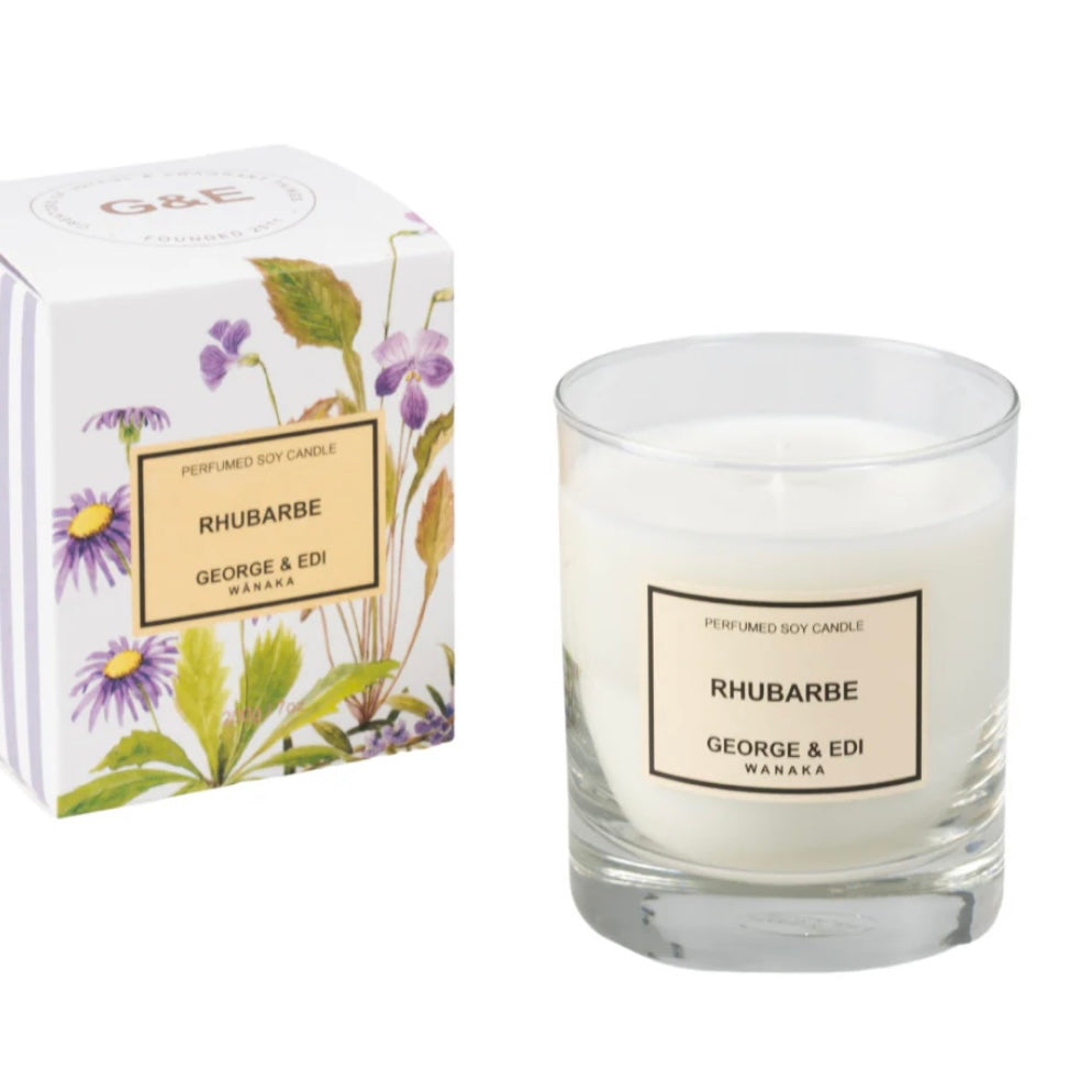 Glass candle labeled 'Rhubarbe' by George & Edi with packaging on a white background