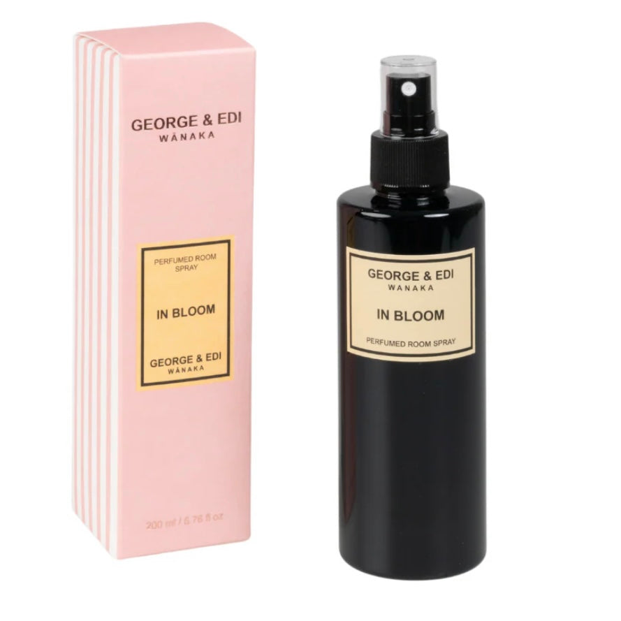 Perfume bottle and packaging of 'In Bloom' by George & Edi on a white background