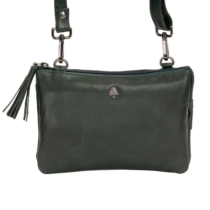 Green leather handbag with a visible brand logo on a white background