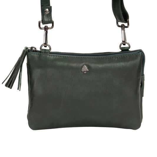 Green leather handbag with a visible brand logo on a white background