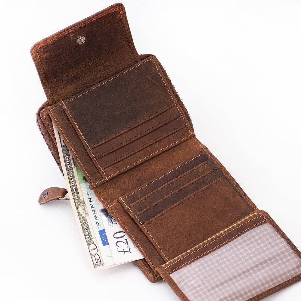 Brown leather wallet with money on a white background