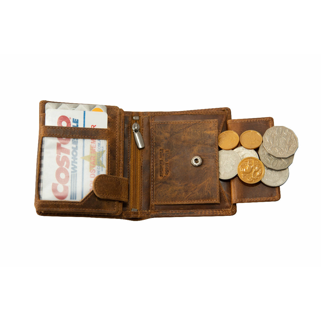 Brown leather wallet with money and coins on a white background