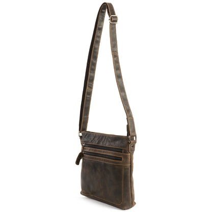 Brown leather crossbody bag with a strap on a white background