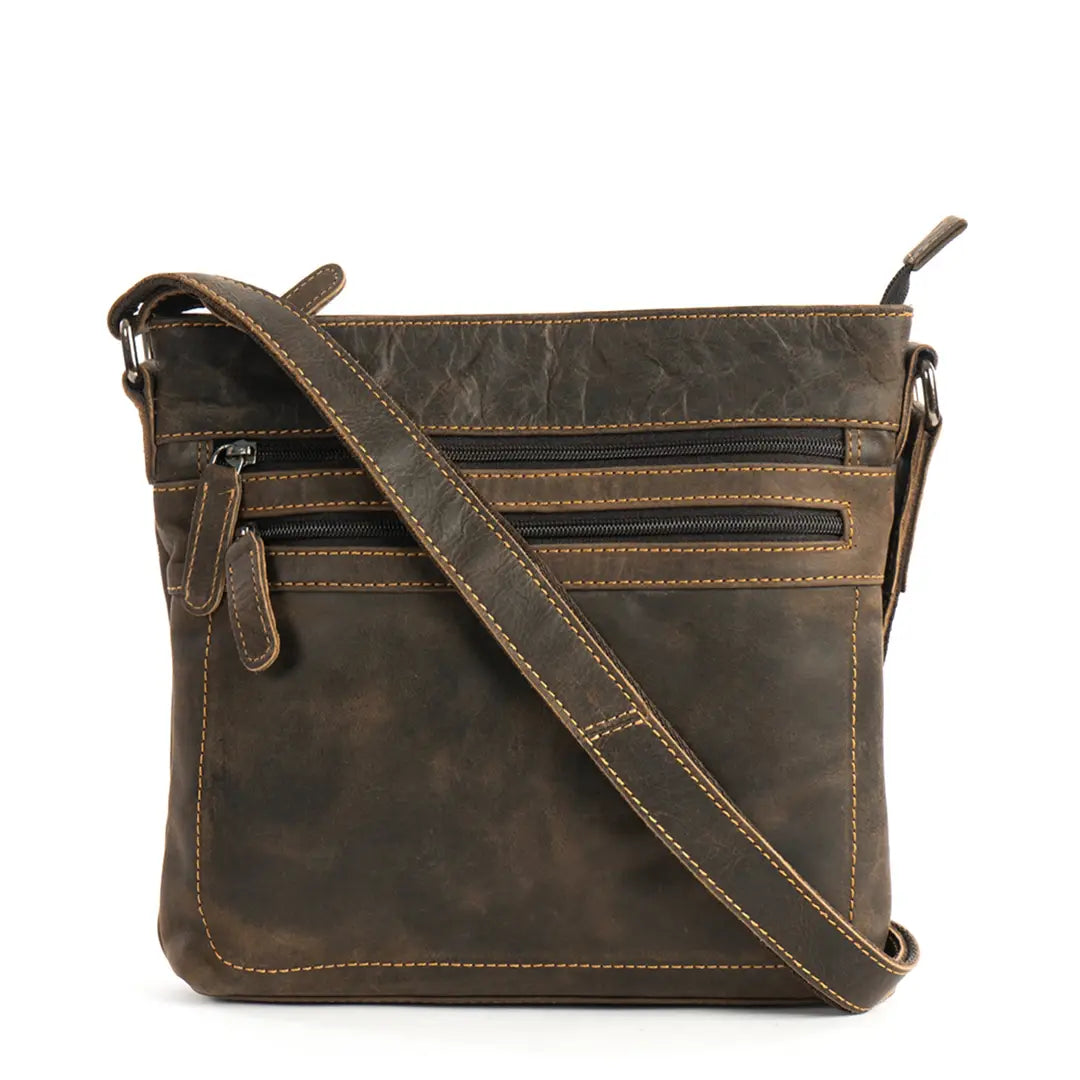 Brown leather crossbody bag on a white background