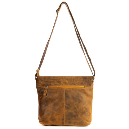 A brown distressed leather crossbody bag with a single shoulder strap, a front zippered pocket, and a vertical seam on the front, shown against a plain white background.