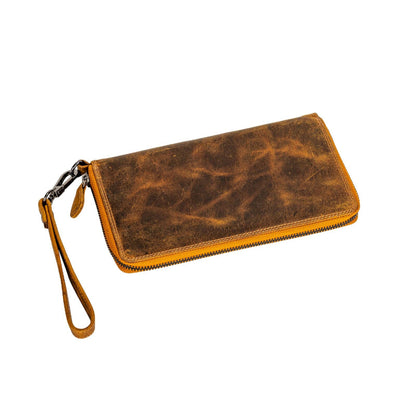 Brown leather wallet with wrist strap on a white background