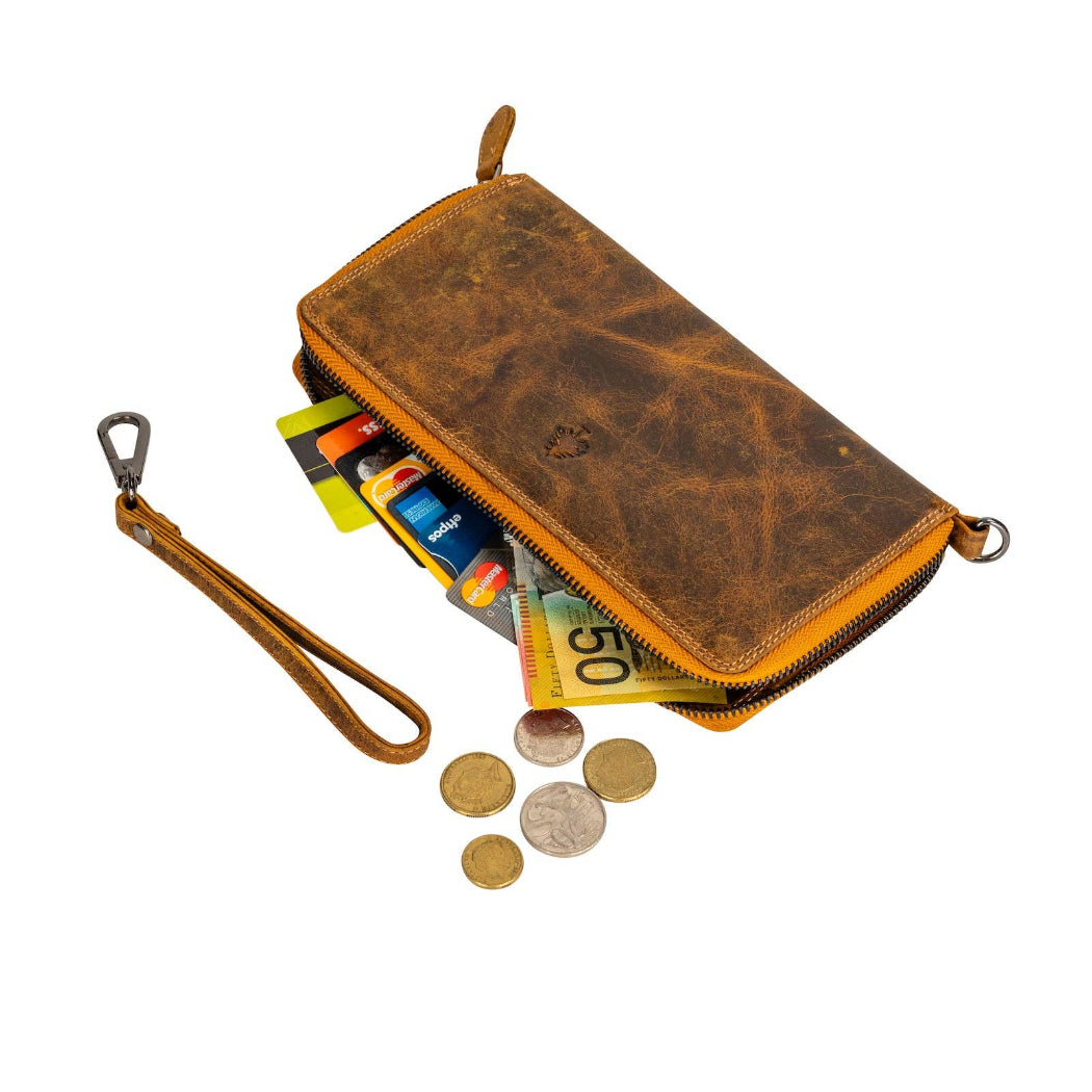 Brown leather wallet with coins and cards on a white background