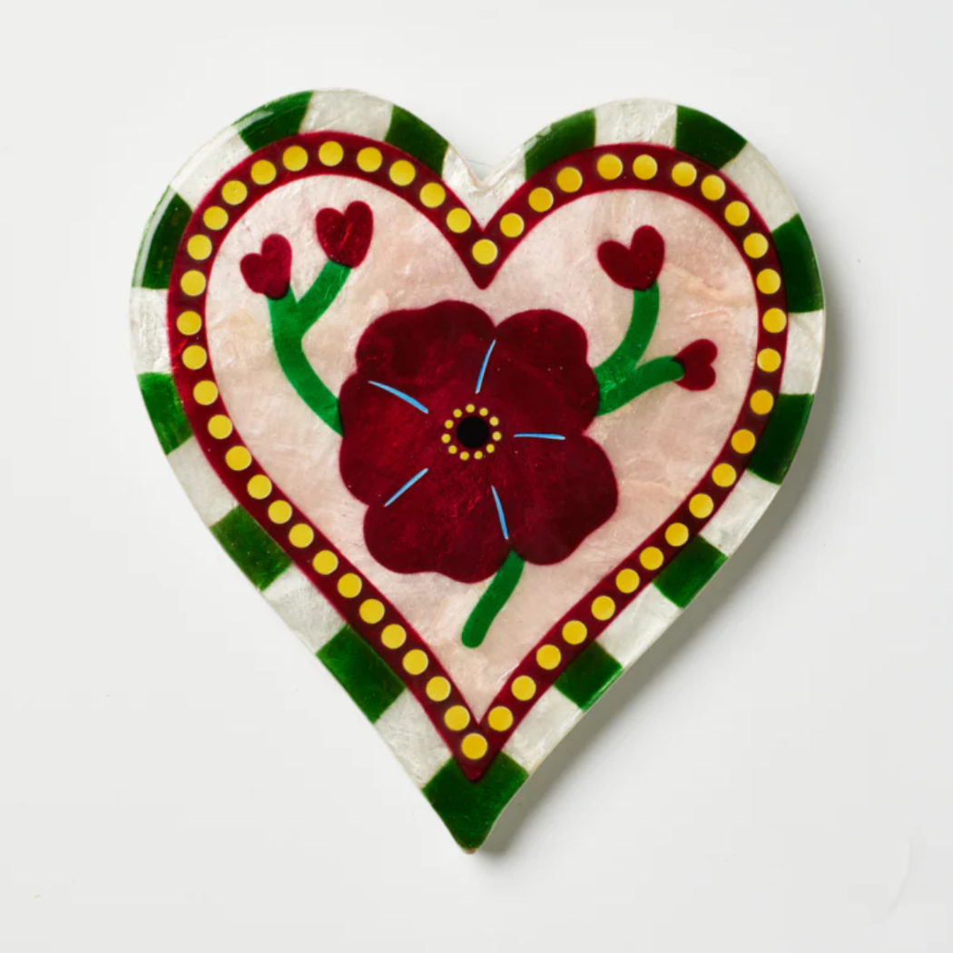 Decorative heart-shaped wine bottle stopper with floral design on a white background, displayed on Jones & Co. website.