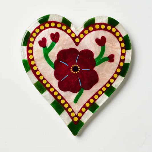 Decorative heart-shaped wine bottle stopper with floral design on a white background, displayed on Jones & Co. website.