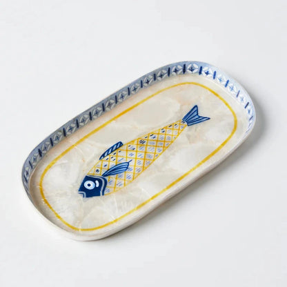 Rectangular ceramic dish with fish design on a white background