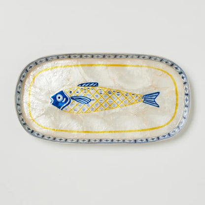 Decorative plate with a fish design on a white background
