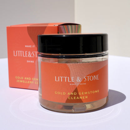 Jar of Little & Stone jewelry cleaner with packaging on a white background