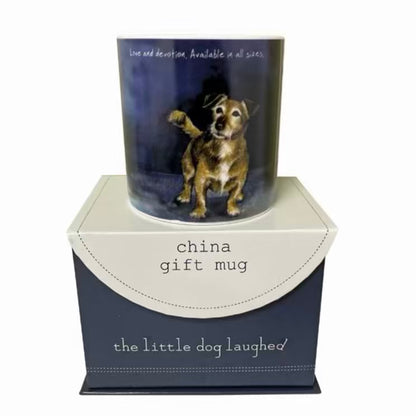 Gift mug with a dog illustration in a decorative box labeled 'the little dog laughed'.