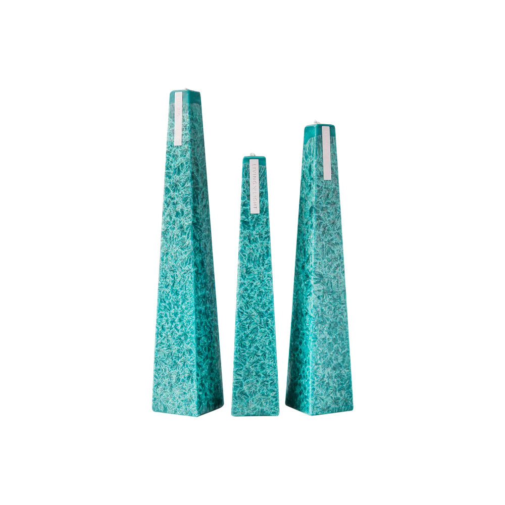 Set of three textured teal vases on a white background