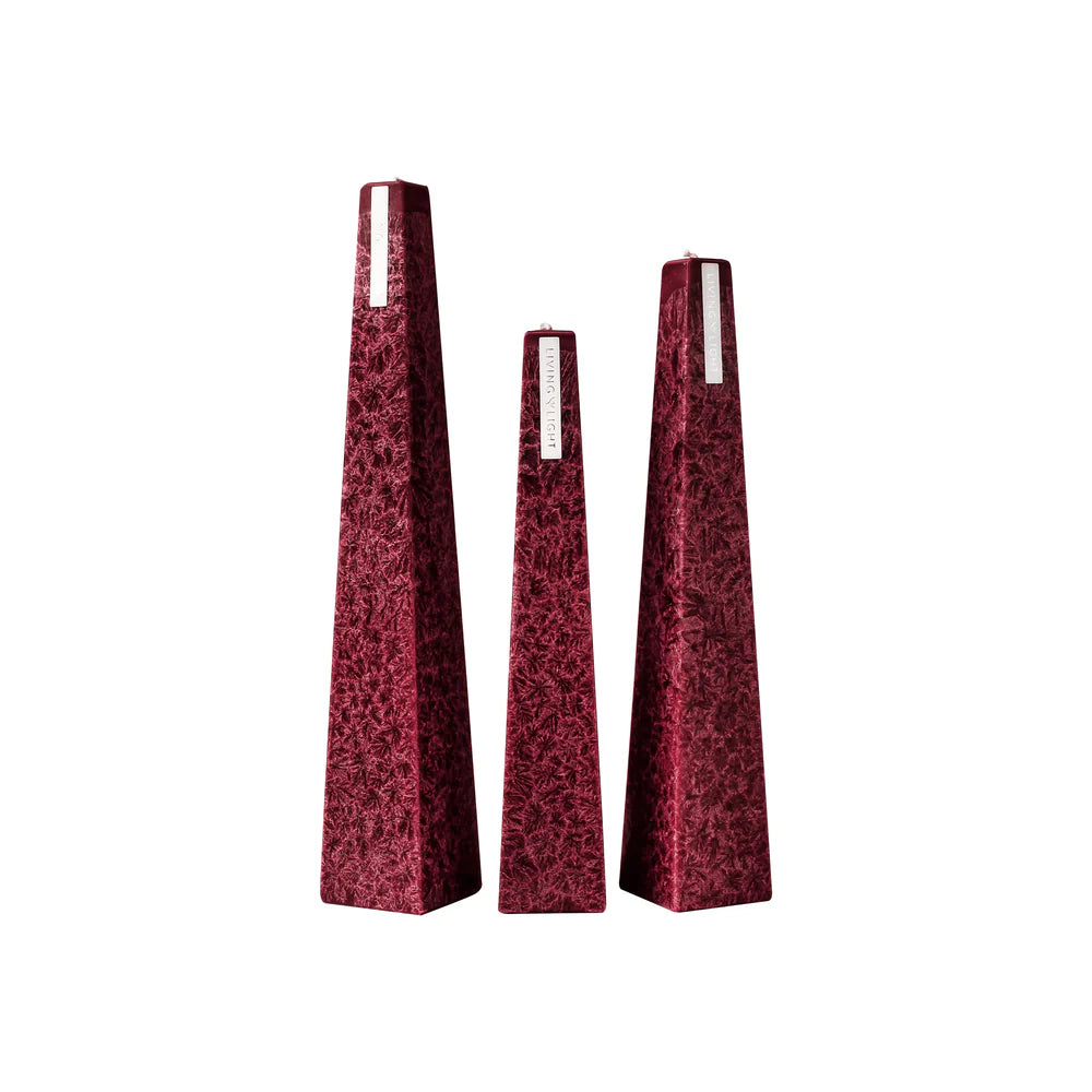 Set of three red pyramid-shaped vases on a white background
