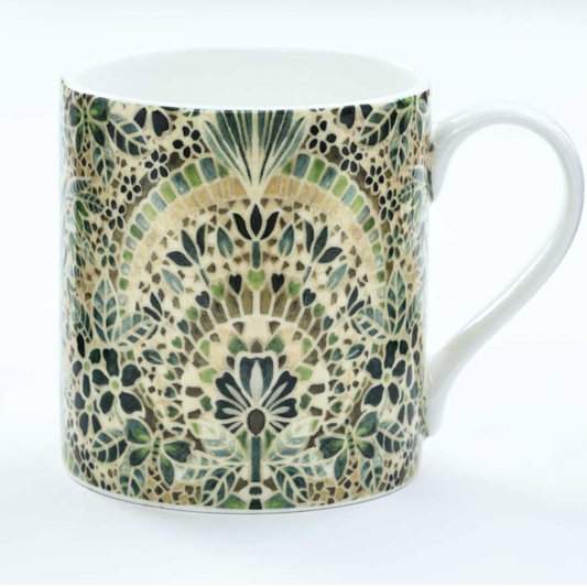 Mug with a decorative green and beige pattern on a white background