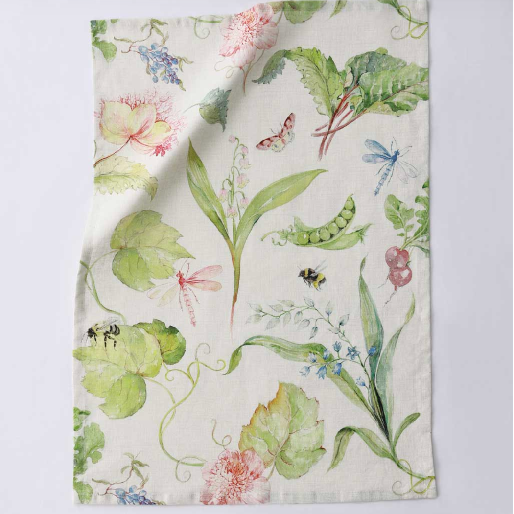 Floral and leaf patterned fabric on a white background